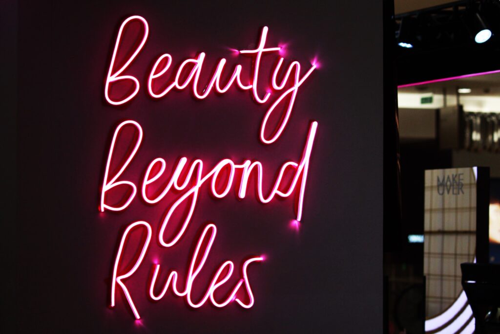 LED signage that says Beauty Beyond Rules